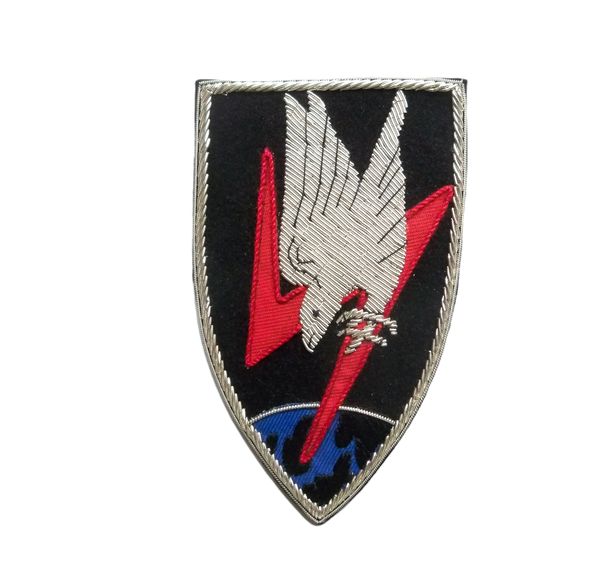 Luftwaffe NJG1 shield-shaped patch.  Black background with red lightening flash and silver diving eagle with claws outstretched screaming towards Europe at the bottom of the patch.